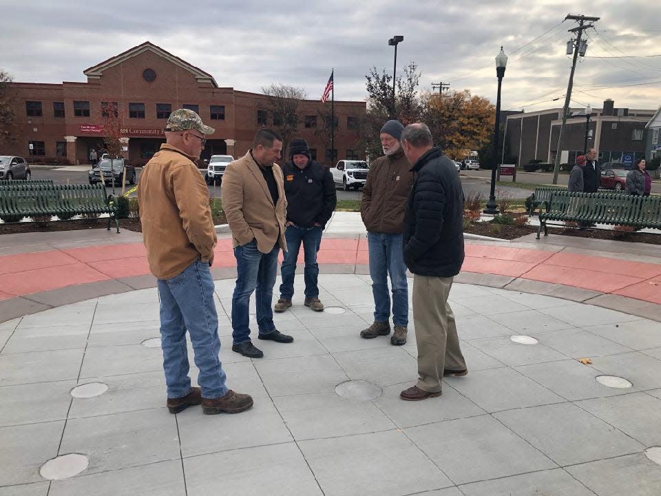 Officials survey the location of the in-ground fountain at Hornell's new Union Square Park at the corner of Seneca and Genesee streets. The fountain will run on a timer and will mainly be in use each summer from Memorial Day to Labor Day.