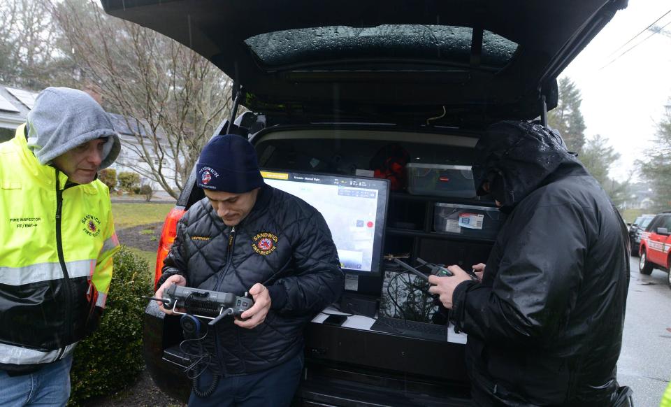 Sandwich fire officials and Barnstable police huddled out of the rain Saturday morning as they monitored a pair of infrared drones searching the neighborhood on Tanglewood Drive in Osterville for an older man reported missing. The search brought in units from across the Cape including police dogs and drone experts, according to the Barnstable police.