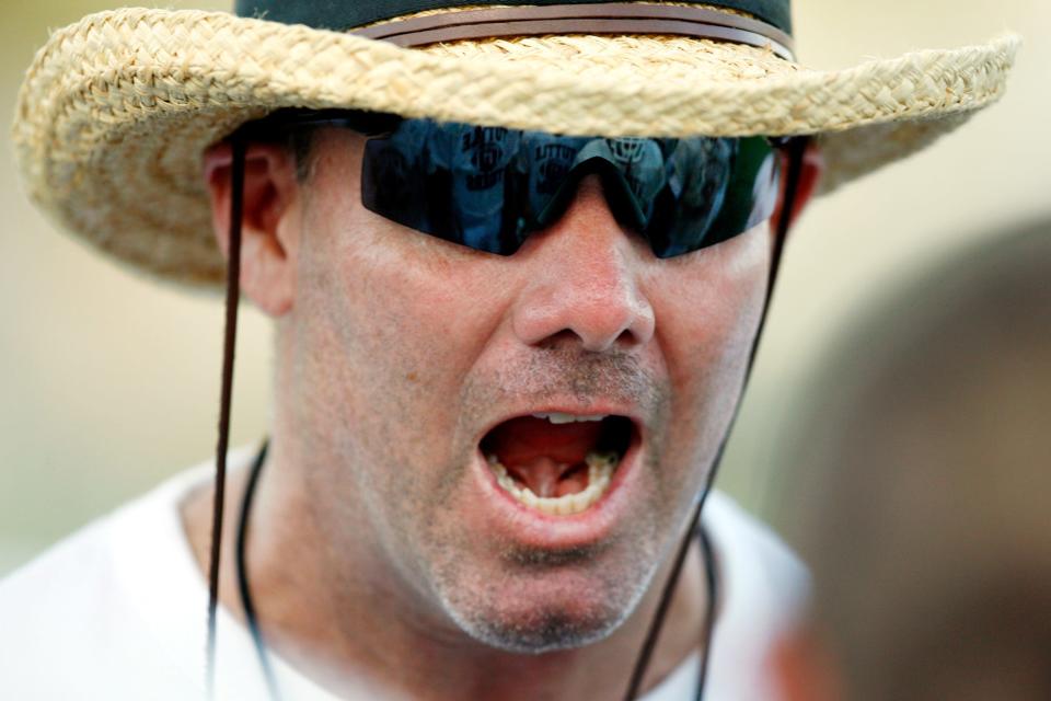 Coach Philip Koons gives instructions to his players during a scrimmage at Bill Hinkle Field in Tuttle on Aug. 23, 2007. Koons coached at Tuttle for 21 seasons before resigning in 2014.