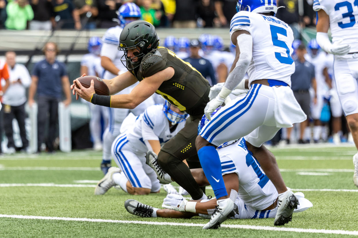 EUGENE, OR - SEPTEMBER 17: Quarterback Bo Nix #10 of the Oregon DucksDucks dives for a touchdown during the first quarter against the Brigham Young Cougars at Autzen Stadium on September 17, 2022 in Eugene, Oregon. (Photo by Tom Hauck/Getty Images)