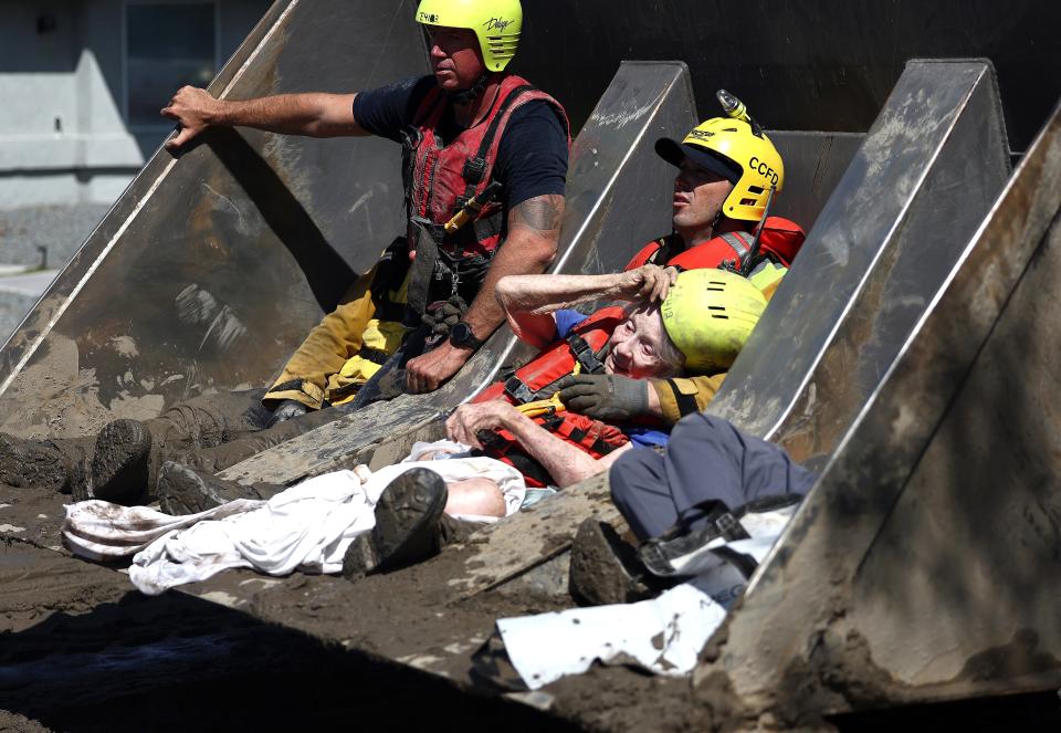 Elderly residents are rescued by members of the Cathedral City Fire Department in a bulldozer after Tropical Storm Hilary flooded the area on August 21, 2023 (Getty Images)