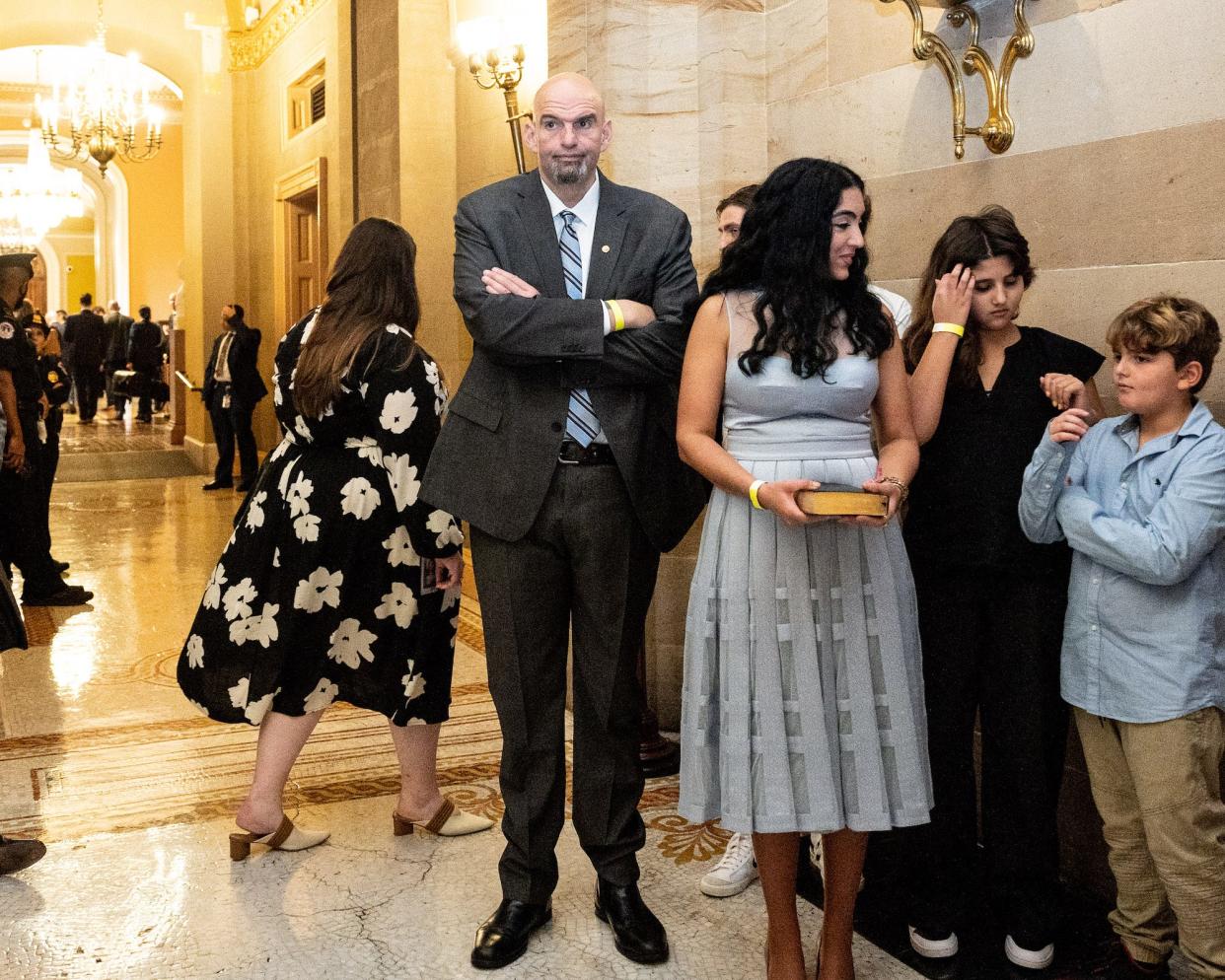 Democratic Sen. John Fetterman of Pennsylvania and his family await their turn in the Old Senate Chamber on January 3, 2023.