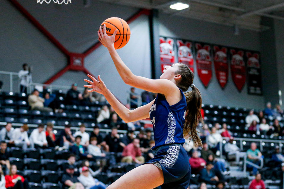 Edmond North’s Allison Heathcock (13) lays up the ball during the Mustang Holiday Classic final round of the Girls Basketball tournament between Edmond North and Mustang in Mustang Okla., on Saturday, Dec. 30, 2023.