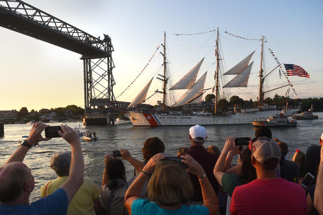 As the sun lowers in the sky, spectators catch a glimpse of the USCGC Eagle approaching the Memorial Bridge and then going under it as people gasped about how close the tallest mast was to the bridge during Sail Portsmouth 2019.
[Deb Cram/Seacoastonline and Fosters.com]