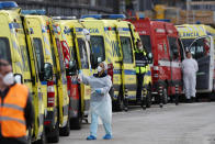 FILE - In this Jan. 22, 2021, file photo, more than a dozen ambulances queue waiting to hand over their COVID-19 patients to medics at the Santa Maria hospital in Lisbon. In its fight against COVID-19, Portugal lifted restrictions on gatherings and movements for four days over Christmas so that people could spend the festive season with family and friends. Soon after the holiday, the pandemic quickly got out of hand. (AP Photo/Armando Franca, File)