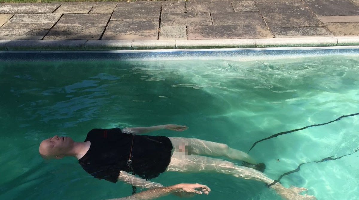 Police released this image of a manikin in a pool to clear up reports of a 'man' being put in a car boot. (SWNS)