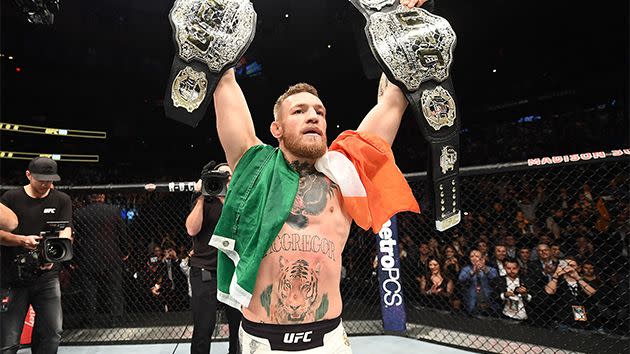 McGregor created history at UFC 205. Image: Getty