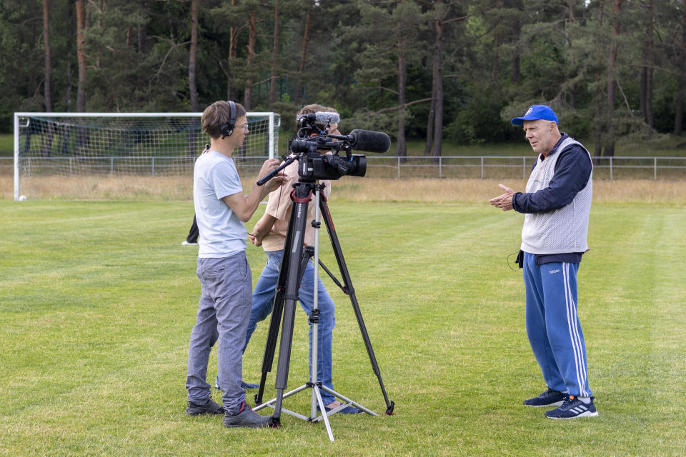 Makkabi Berlin coach Wolfgang Sandhowe speaks to local journalists before training in Berlin, Germany, Tuesday, May 21, 2024. Makkabi became the first Jewish club to play in the German Cup and it's bidding to reach the competition again on Saturday, May 25, when it plays Victoria Berlin in the Berlin Cup final. (AP Photo/Ciaran Fahey)