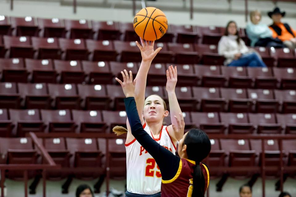 Dale’s Teague Muncy (25) shoots over Clinton’s DanyElla RedShin (2) during a Cashion County Line Tournament game between Clinton and Dale in Cashion, Okla., on Thursday, Jan. 18, 2024.