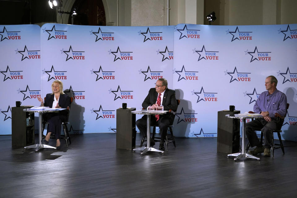 Gubernatorial candidates, from left, Democratic Gov. Janet Mills, Republican Paul LePage, and independent Sam Hunkler participate in a debate, Tuesday, Oct. 4, 2022, at the Franco Center in Lewiston, Maine. (AP Photo/Robert F. Bukaty)