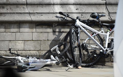 A bicycle lies on the ground after the Westminster attack - Credit: Eddie Mulholland for The Telegraph 