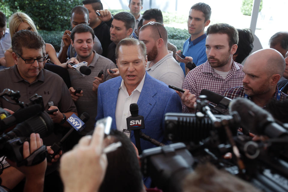 FILE - In this Nov. 15, 2017, file photo, Sports agent Scott Boras answers questions during a news conference at the annual MLB baseball general managers' meetings in Orlando, Fla. Nearly 30 years after negotiating his first contract, Boras worked out $814 million in deals for Stephen Strasburg, Gerrit Cole and Anthony Rendon in a three-day span, part of what is expected to be a $1.2 billion offseason for baseball's most visible agent. (AP Photo/John Raoux, File)