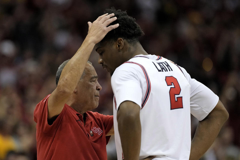 Houston head coach Kelvin Sampson talks to center Cedric Lath (2) as he comes off the court during the second half of an NCAA college basketball game against Iowa State in the championship of the Big 12 Conference tournament, Saturday, March 16, 2024, in Kansas City, Mo. (AP Photo/Charlie Riedel)