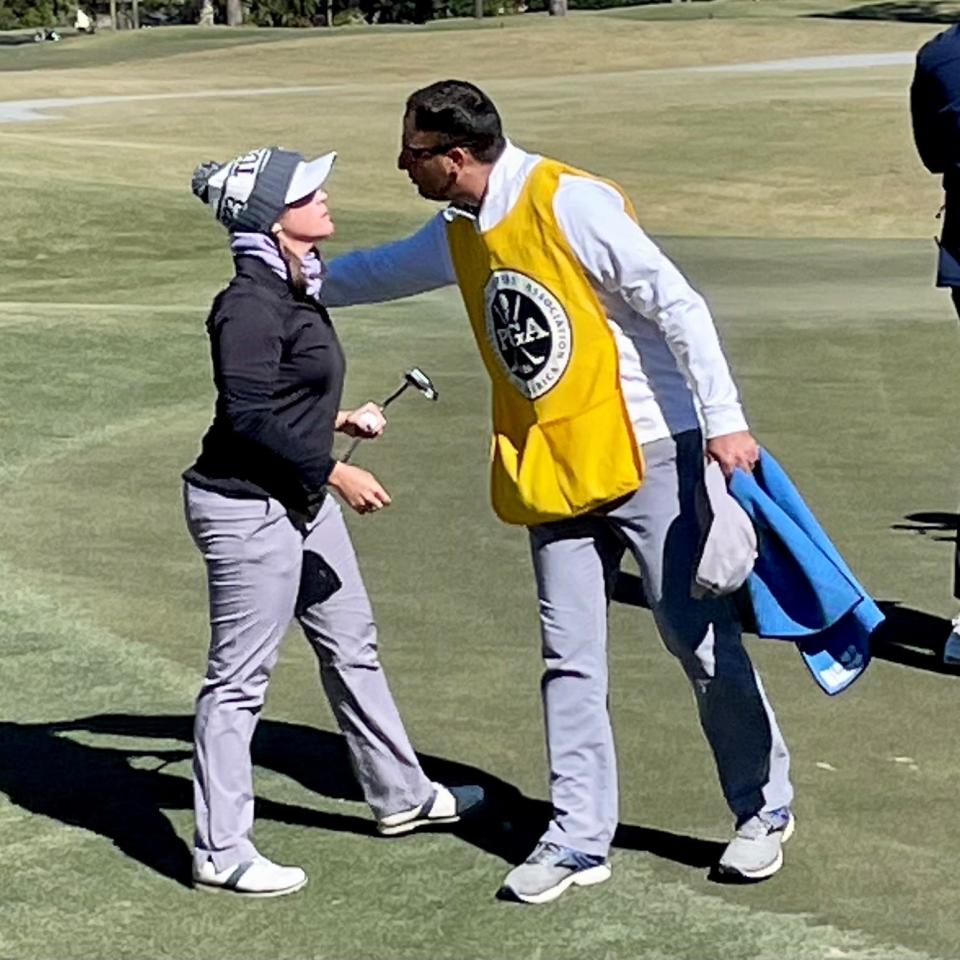 Stephanie Connelly-Eiswerth of the Eagle Harbor Golf Club is congratulated by her husband and caddie Adam Eiswerth after winning her singles match on Tuesday in the Underwood Cup Matches at the San Jose Country Club.