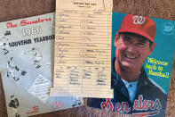 Washington Senators memorabilia including the lineup card from a game between the Senators and Boston Red Sox on April 13, 1971, in Washington, and a program featuring Ted Williams, right, are shown in New York, Tuesday, Oct. 15, 2019. (AP Photo/Ben Walker)