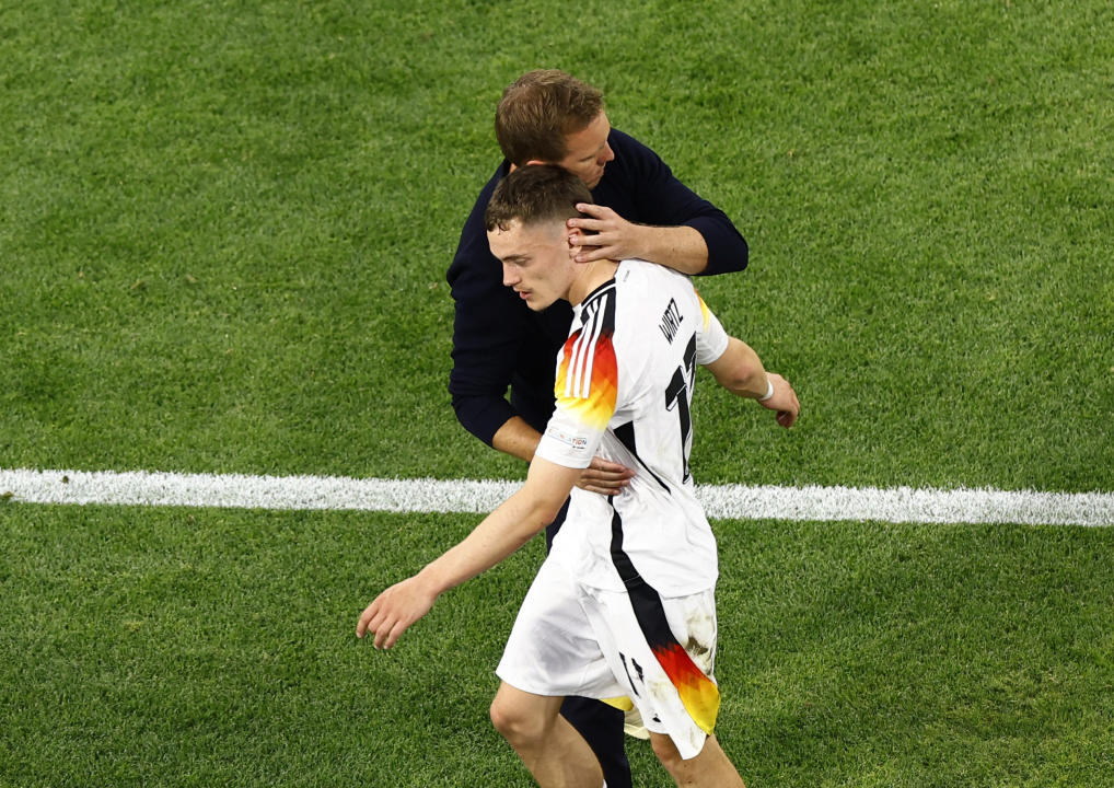 Soccer Football - Euro 2024 - Group A - Germany v Scotland - Munich Football Arena, Munich, Germany - June 14, 2024  Germany's Florian Wirtz with coach Julian Nagelsmann after being substituted REUTERS/Michaela Stache