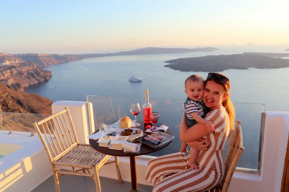 And baby comes too - Carr with baby Leo in Santorini. (SWNS)