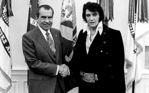  President Richard Nixon meets with Elvis Presley December 21, 1970 at the White House - Credit: National Archives/Getty Images