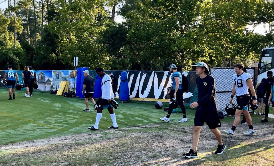 Jaguars players and staff arrive at the Episcopal School's Knight Campus on Thursday for the final practice of training camp.