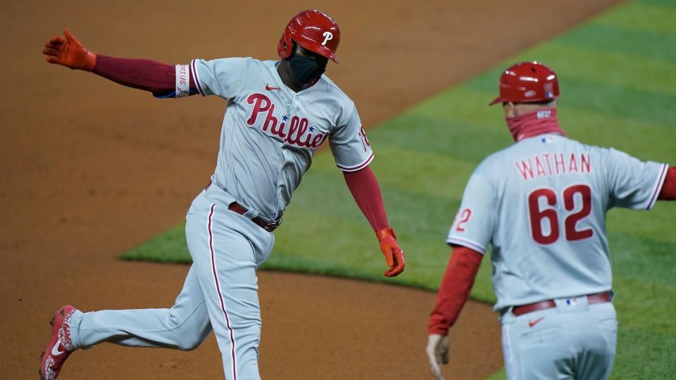 Mandatory Credit: Photo by Wilfredo Lee/AP/Shutterstock (10775027c)Philadelphia Phillies' Didi Gregorius, left, celebrates with third base coach Dusty Wathan as he rounds third base after hitting a grand slam, also coring Bryce Harper, J.