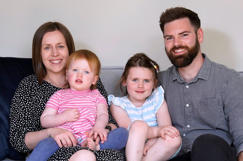 Opal Sandy (second left), who was born completely deaf because of a rare genetic condition and can now hear unaided for the first time
