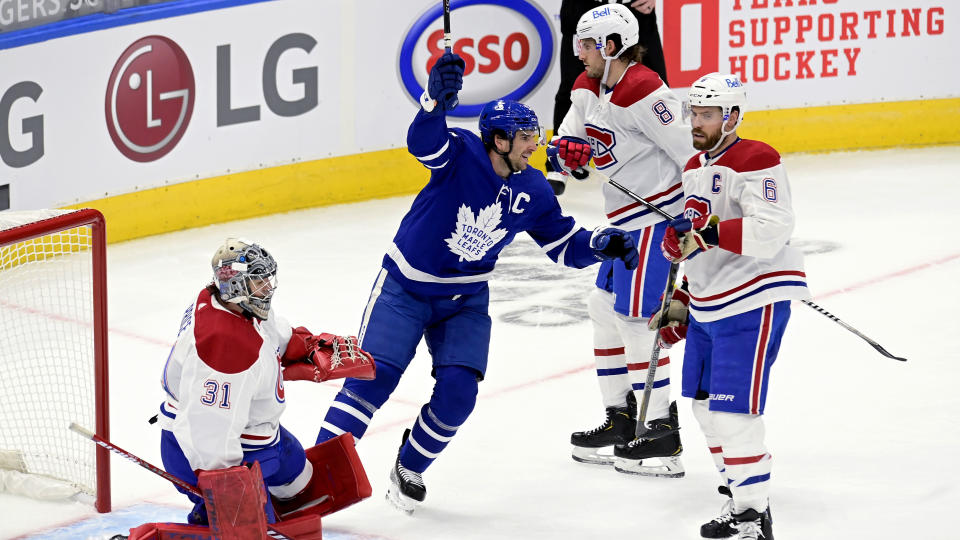 Toronto Maple Leafs' John Tavares (91) celebrates after scoring on Montreal Canadiens goaltender Carey Price (31) during the first period of an NHL hockey game in Toronto, Wednesday, Jan. 13, 2021. (Frank Gunn/The Canadian Press via AP)