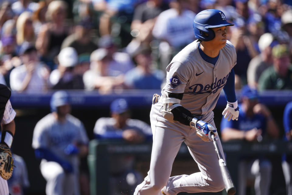 Los Angeles Dodgers' Shohei Ohtani heads up the first base line after hitting a ground ball off Colorado Rockies starting pitcher Ryan Feltner in the first inning of a baseball game Sunday, Sept. 29, 2024, in Denver. (AP Photo/David Zalubowski)