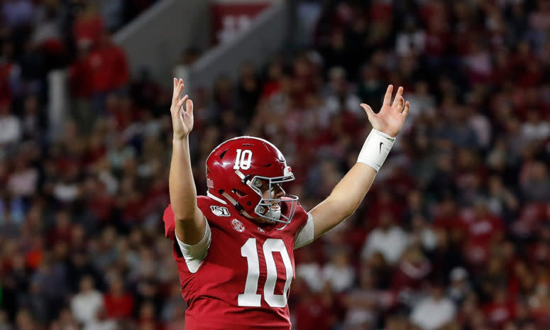 Mac Jones celebrates a touchdown throw for Alabama football.