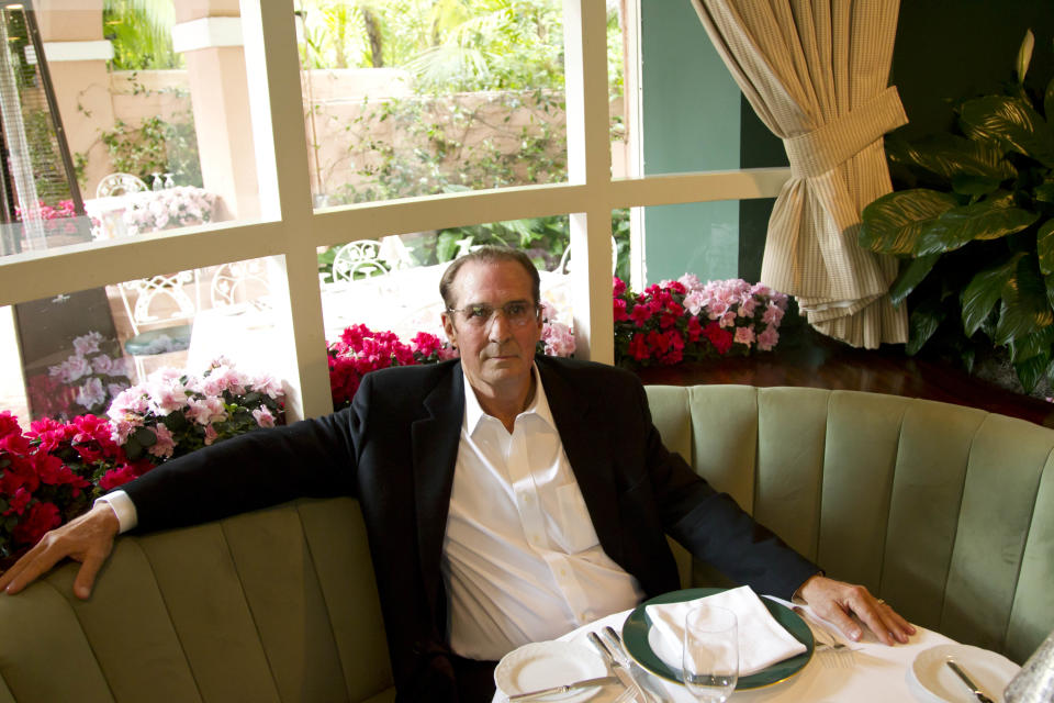 In this April 25, 2012 photo, Robert S. Anderson, author and Beverly Hills Hotel historian, poses for a portrait inside The Polo Lounge at the Beverly Hills Hotel in Beverly Hills, Calif. Anderson's book "The Beverly Hills Hotel - The First 100 Years" celebrates the 100th anniversary of the Beverly Hills Hotel. (AP Photo/Matt Sayles)