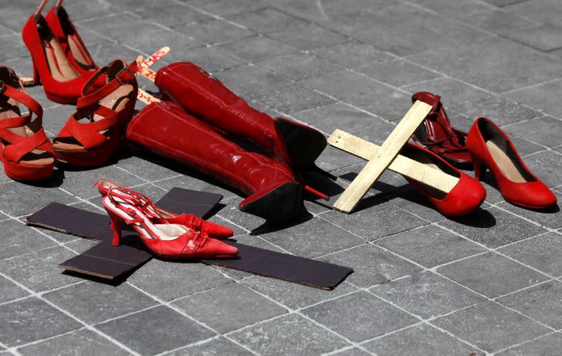 Red women's shoes are seen placed by a protester at the main square Zocalo, during the "A Day Without Women" protest, as part of the escalation of historic protests against gender violence, in Mexico City