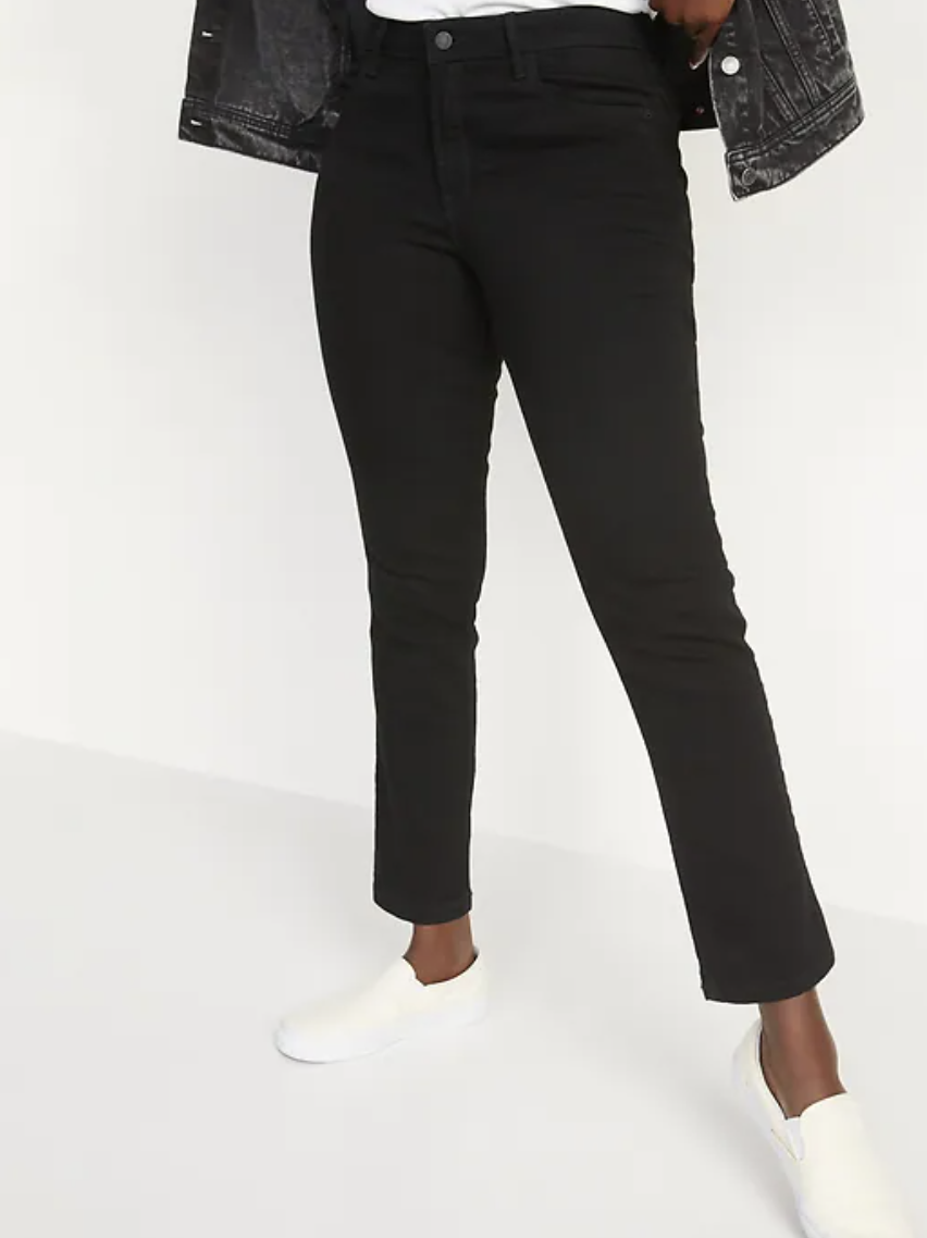 woman wearing white shoes and Mid-Rise Power Slim Straight Black Jeans 