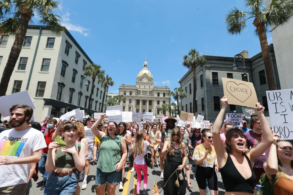 Marchers take over Bull Street Saturday during a march for abortion rights.