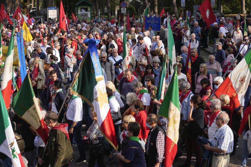 People gather during a march organized by the Italian Partisans association in Mussolini's birthplace Predappio Friday, Oct. 28, 2022, to mark the 78th anniversary of the liberation of the town from the nazi-fascist occupation by Italian Partisans and Polish allied troops, which coincides with the 100th anniversary of the march on Rome. (AP Photo/Luca Bruno)