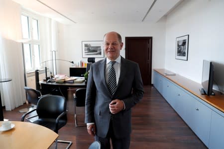 FILE PHOTO: German Finance Minister Olaf Scholz is pictured in his office during an interview with Reuters in Berlin