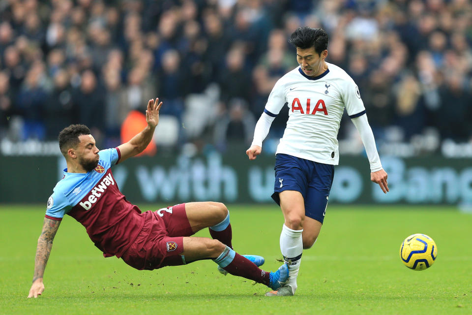 LONDON, ENGLAND - NOVEMBER 23: Ryan Fredericks of West Ham United fouls Heung-Min Son of Tottenham Hotspur and receives a yellow card during the Premier League match between West Ham United and Tottenham Hotspur at London Stadium on November 23, 2019 in London, United Kingdom. (Photo by Stephen Pond/Getty Images)