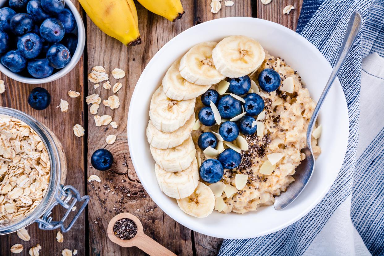 Breakfast: oatmeal with bananas, blueberries, chia seeds and almonds. Top view