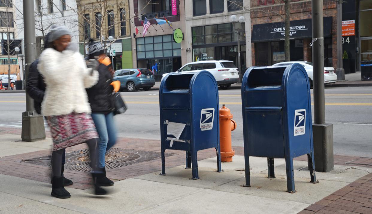 U.S. Postal Service collection boxes on Jan. 3, 2024, in downtown Columbus. Anthony J. Williams, 19, of Columbus, is accused in a federal indictment of robbing postal carriers at gunpoint of their arrow keys that can access such collection boxes.