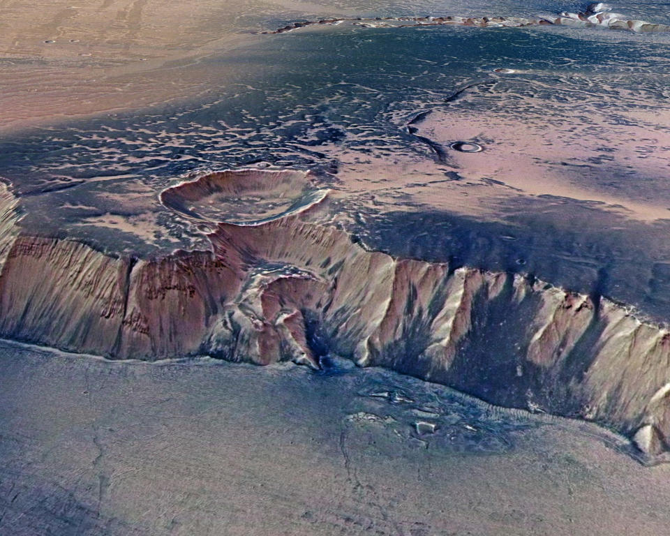 A cliff, up to 4,000 m high, located in the eastern part of Echus Chasma, one of the largest water source regions on Mars, is seen in this image taken by the High-Resolution Stereo Camera (HRSC) on board ESAís Mars Express and made available July 14, 2008. Echus Chasma is the source region of Kasei Valles which extends 3,000 km to the north. The dark regions REUTERS/ESA/DLR/FU Berlin/G.Neukum/Handout. FOR EDITORIAL USE ONLY. NOT FOR SALE FOR MARKETING OR ADVERTISING CAMPAIGNS.