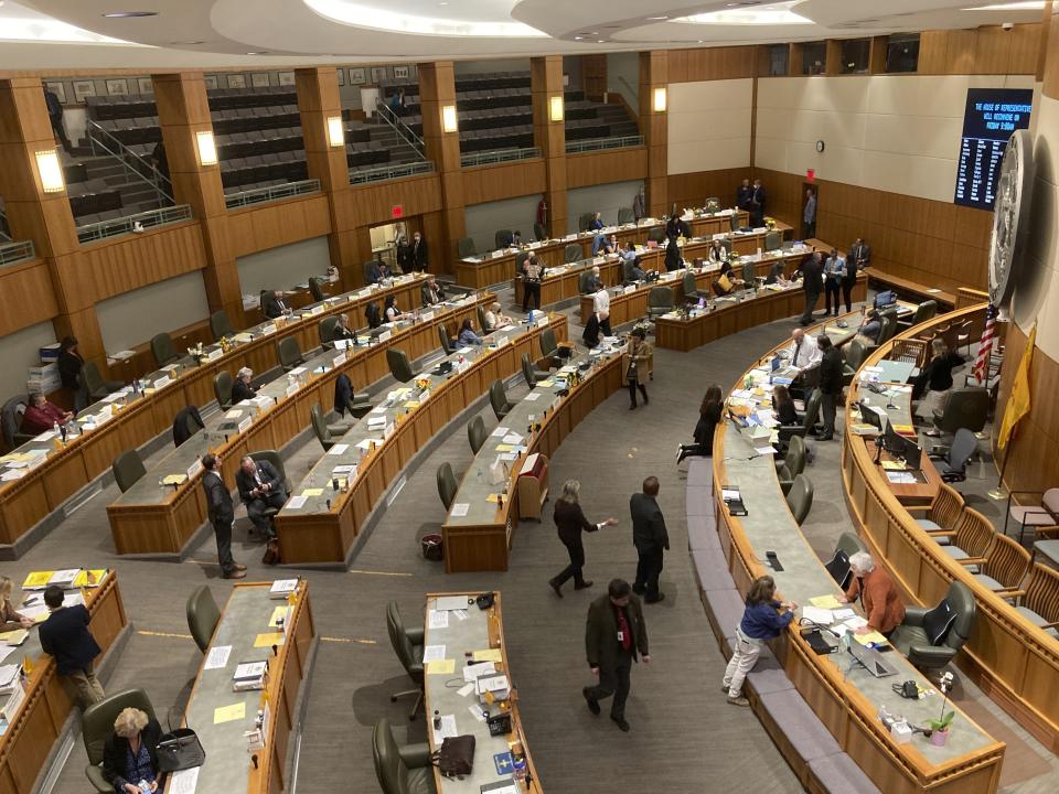 The New Mexico House of Representatives adjourns for the night on Thursday, March 16, 2023, in Santa Fe, N.M. (AP Photo/Morgan Lee)