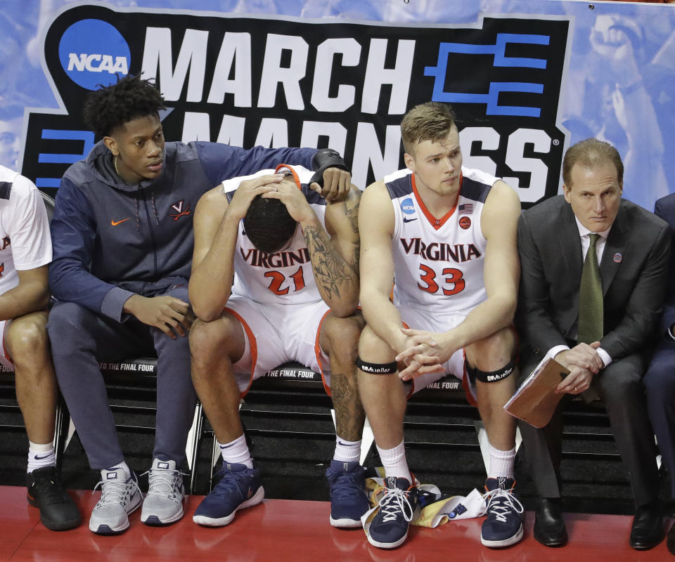 Virginia’s Isaiah Wilkins (21) is consoled after fouling out during the second half of a first-round game against UMBC in the NCAA men’s college basketball tournament. (AP)