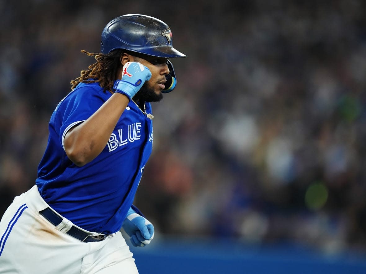 Toronto Blue Jays first baseman Vladimir Guerrero Jr. celebrates his RBI sacrifice fly during a game in September. The Blue Jays officially clinched a spot in the post-season when the Baltimore Orioles lost to the Boston Red Sox on Thursday. (Nathan Denette/The Canadian Press - image credit)