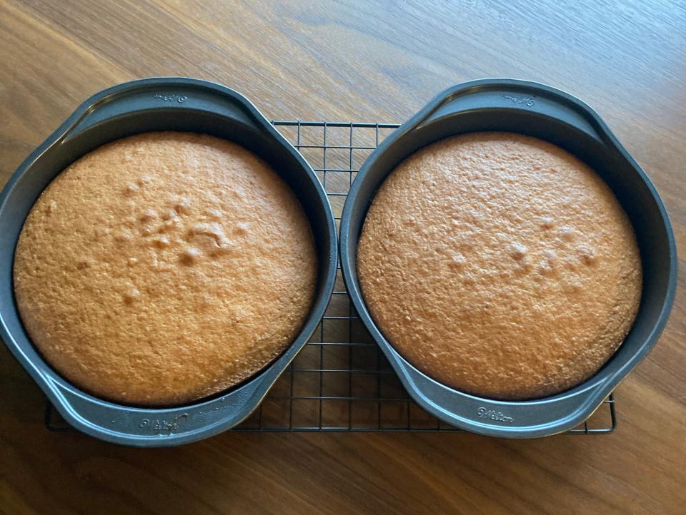 Pillsbury cake mix in the cake pans on a cooling rack