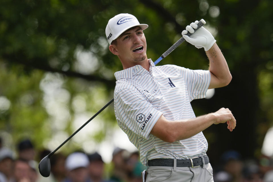 Sam Bennett watches his tee shot on the fourth hole during the second round of the Masters golf tournament at Augusta National Golf Club on Friday, April 7, 2023, in Augusta, Ga. (AP Photo/Mark Baker)