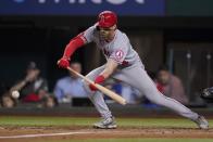 Los Angeles Angels' Tyler Wade grounds out on a bunt during the fifth inning of the team's baseball game against the Texas Rangers, Wednesday, May 18, 2022, in Arlington, Texas. (AP Photo/Tony Gutierrez)