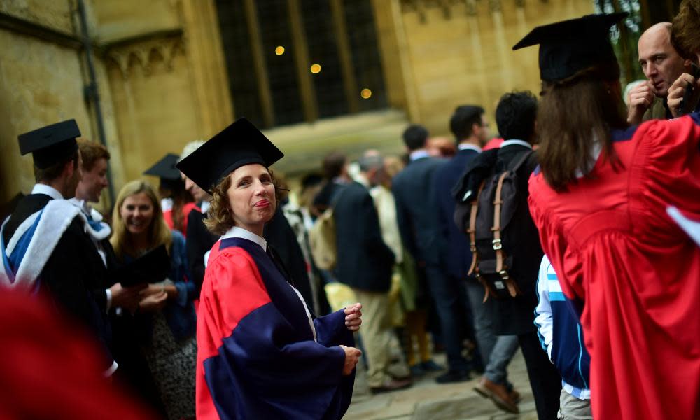 Graduates gather after a graduation ceremony at Oxford University: the industrial action may disrupt this summer’s undergraduate exams.