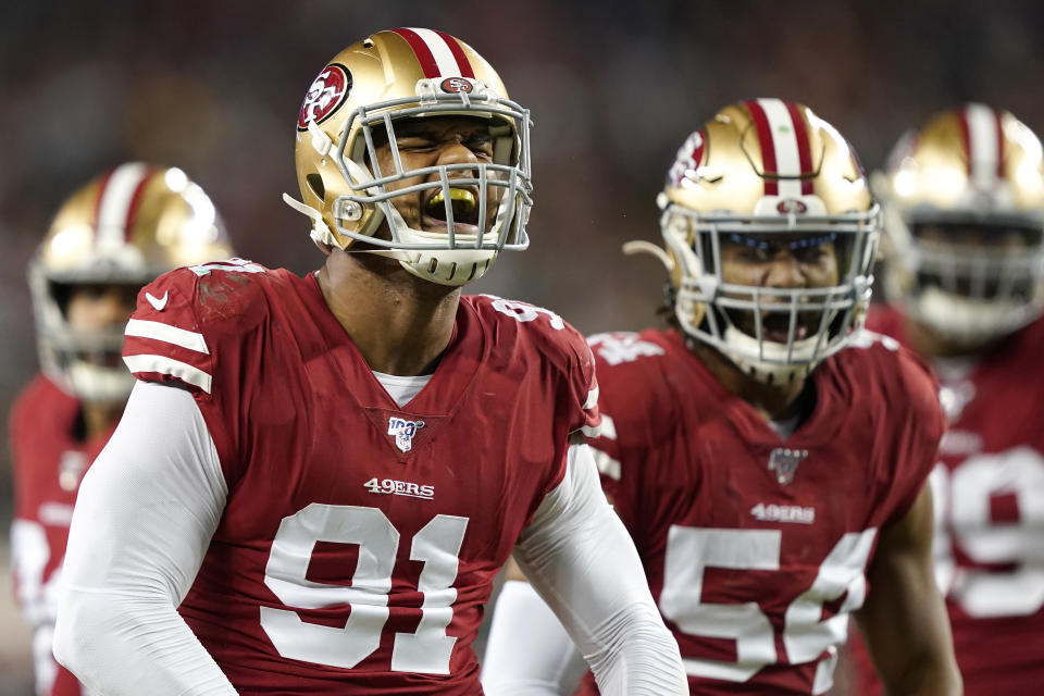 San Francisco 49ers defensive end Arik Armstead (91) celebrates with middle linebacker Fred Warner (54) during the first half of an NFL football game against the Green Bay Packers in Santa Clara, Calif., Sunday, Nov. 24, 2019. (AP Photo/Tony Avelar)