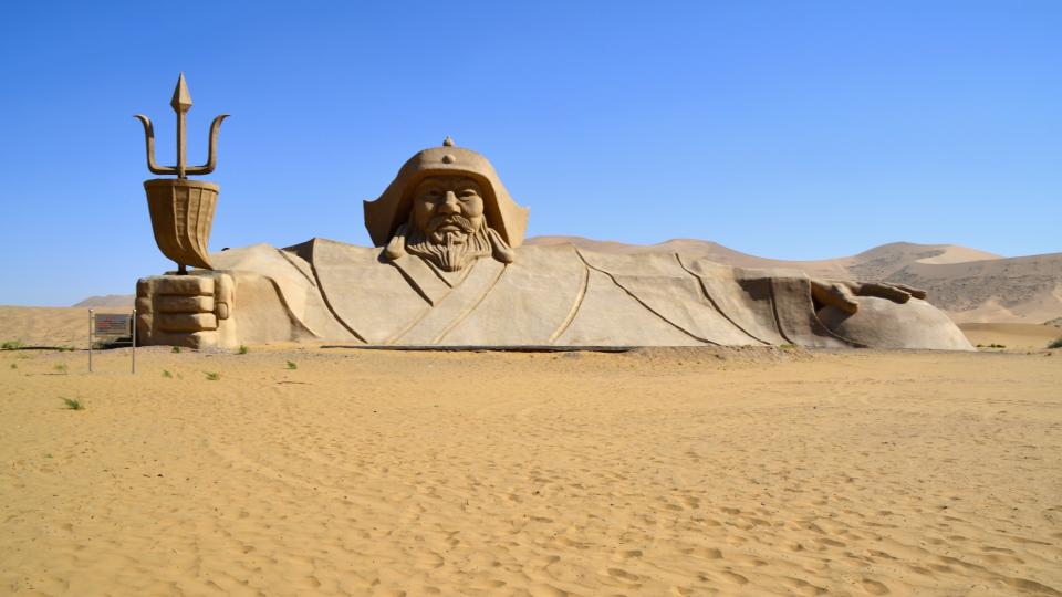 The enormous Genghis Khan statue in the middle of Badain Jaran desert. This desert is home to some of the tallest stationary dunes on Earth, some reaching a height of more than 500 meters. The desert features over 100 lakes that lie between the dunes, some of which are fresh water while others are extremely saline.