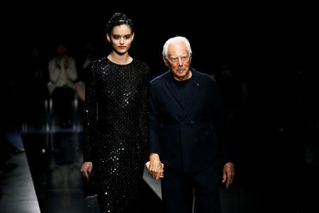 Italian fashion designer Giorgio Armani appears at the end of his show during the Milan Fashion Week in Milan, Italy February 23, 2019. REUTERS/Alessandro Garofalo