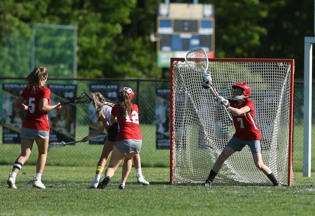 Highland's Leah Klotz shoots to score on Red Hook's Darcy Cavanaugh during a game on May 8, 2024.