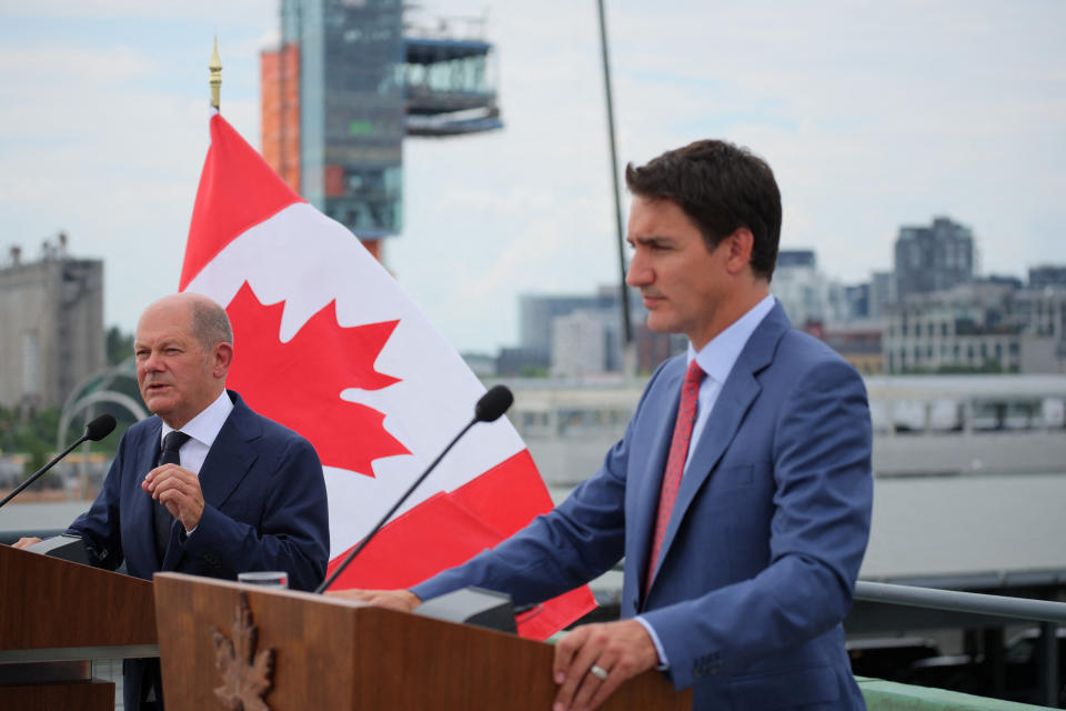 Germany's Chancellor Olaf Scholz and Canada's Prime Minister Justin Trudeau speak to the media outside the Montreal Science Centre, in Montreal, Quebec, Canada August 22, 2022. REUTERS/Christinne Muschi